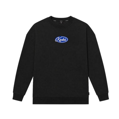 Kecks K Emblem crew neck sweatshirt in black with blue Kecks script emblem on the chest, front view
